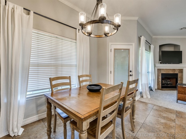 2603 S 16th Pl, Broken Arrow, OK 74012 - dining area with ornamental molding, a chandelier, plenty of natural light, a tiled fireplace, and light tile patterned flooring