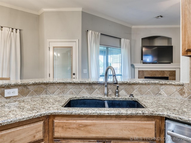2603 S 16th Pl, Broken Arrow, OK 74012 - kitchen with stainless steel dishwasher, backsplash, light stone countertops, and crown molding