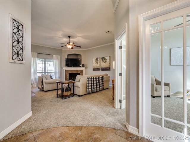 2603 S 16th Pl, Broken Arrow, OK 74012 - living room featuring carpet floors, a ceiling fan, crown molding, and a fireplace