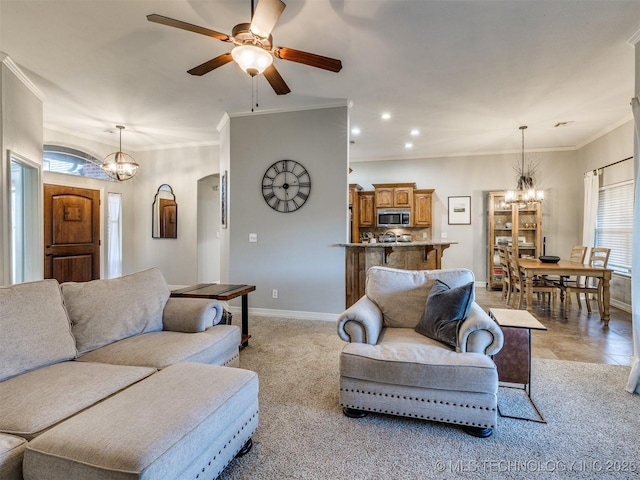 2603 S 16th Pl, Broken Arrow, OK 74012 - living area featuring a chandelier, a ceiling fan, recessed lighting, crown molding, and light colored carpet