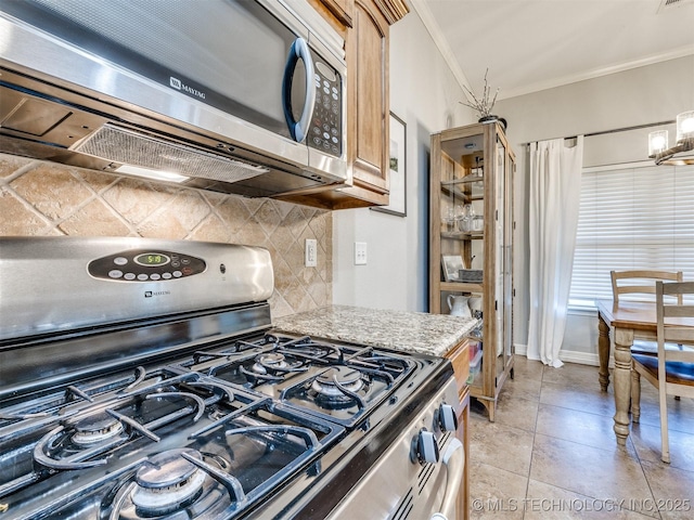 2603 S 16th Pl, Broken Arrow, OK 74012 - kitchen with stainless steel appliances, ornamental molding, tasteful backsplash, light stone counters, and light tile patterned floors