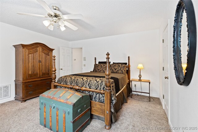 501 W 35th Pl, Sand Springs, OK 74063 - bedroom with light carpet, ceiling fan, and a textured ceiling