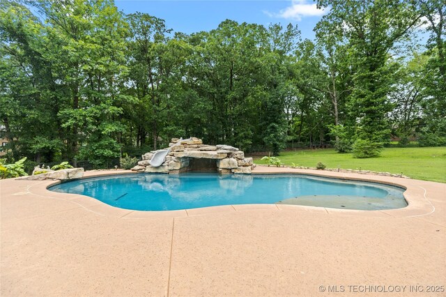 501 W 35th Pl, Sand Springs, OK 74063 - outdoor pool with a water slide, a yard, a patio area, and view of scattered trees