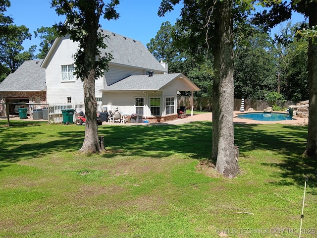 501 W 35th Pl, Sand Springs, OK 74063 - back of property featuring a patio and a shingled roof