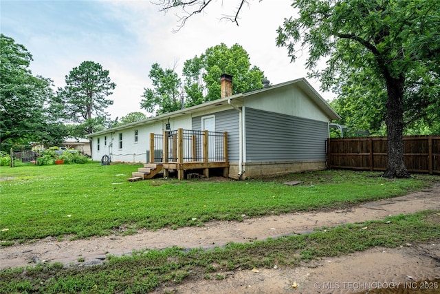 11598 E Oak St, Claremore, OK 74019 - back of house featuring a chimney and a wooden deck