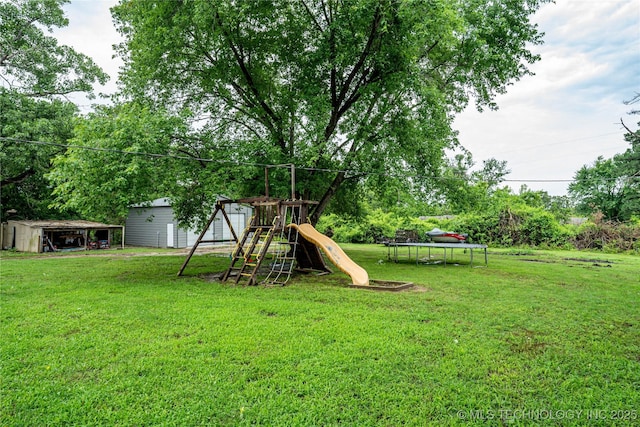 11598 E Oak St, Claremore, OK 74019 - view of green lawn with a playground, an outdoor structure, and view of scattered trees