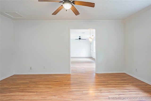 11598 E Oak St, Claremore, OK 74019 - spare room with light wood-style floors, a ceiling fan, ornamental molding, a textured ceiling, and attic access