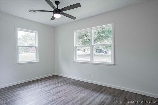 11598 E Oak St, Claremore, OK 74019 - unfurnished room with wood finished floors, healthy amount of natural light, a ceiling fan, and a textured ceiling