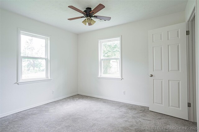 11598 E Oak St, Claremore, OK 74019 - carpeted empty room featuring ceiling fan and a textured ceiling