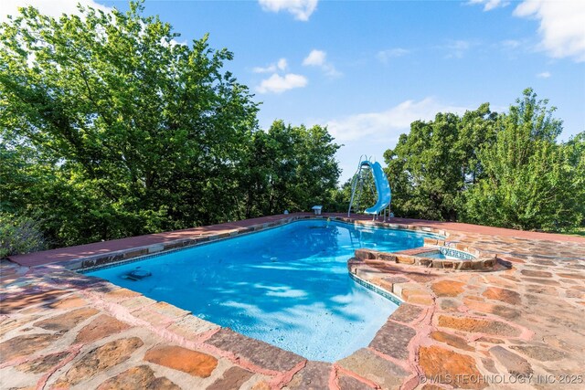 17304 E 176th St S, Bixby, OK 74008 - view of swimming pool featuring a water slide and a pool with connected hot tub