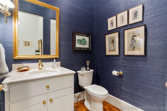 2524 E 66th Pl, Tulsa, OK 74136 - half bathroom with vanity and wood finished floors