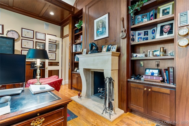 2524 E 66th Pl, Tulsa, OK 74136 - office area featuring light wood-style flooring, crown molding, built in features, and a fireplace with raised hearth