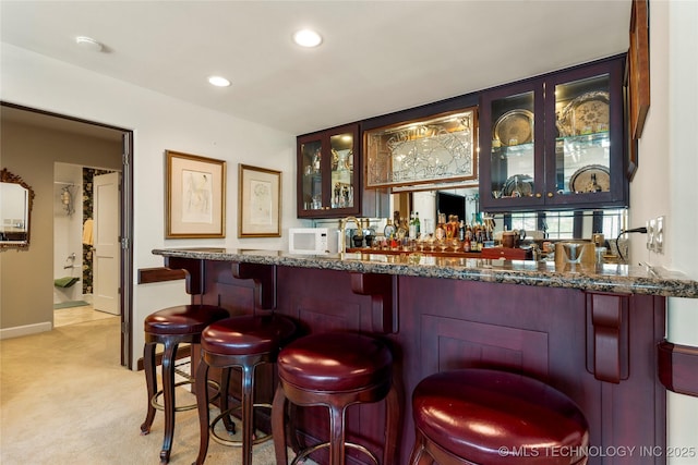 2524 E 66th Pl, Tulsa, OK 74136 - indoor wet bar with light colored carpet and recessed lighting