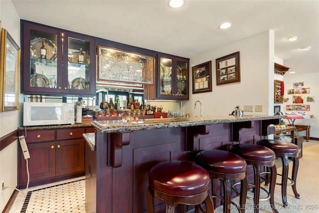 2524 E 66th Pl, Tulsa, OK 74136 - indoor wet bar featuring white microwave and recessed lighting