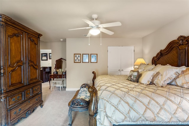 2524 E 66th Pl, Tulsa, OK 74136 - bedroom with light colored carpet, a ceiling fan, and a closet