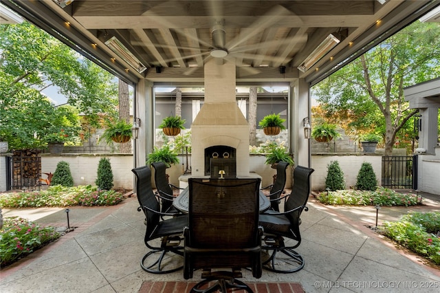 2524 E 66th Pl, Tulsa, OK 74136 - view of patio with an outdoor fireplace, outdoor dining space, and ceiling fan