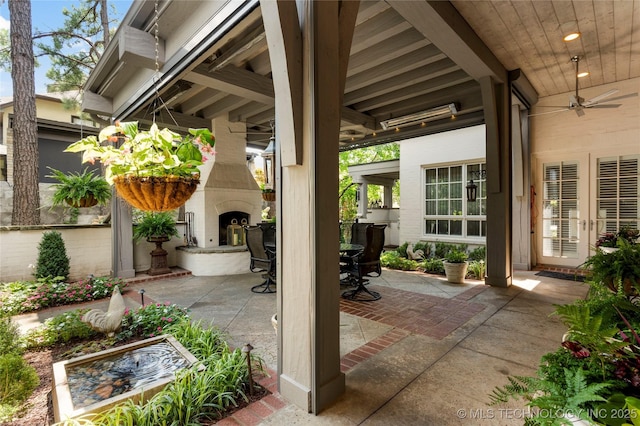 2524 E 66th Pl, Tulsa, OK 74136 - view of patio / terrace featuring a fireplace