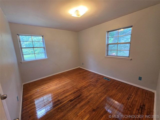 1435 E Jones Ave, Sapulpa, OK 74066 - empty room with wood-type flooring and healthy amount of natural light