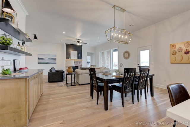 7117 E Queens St, Broken Arrow, OK 74014 - dining space featuring light wood finished floors, ceiling fan, recessed lighting, and ornamental molding