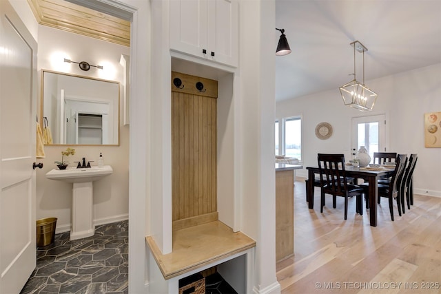 7117 E Queens St, Broken Arrow, OK 74014 - bathroom with a chandelier and wood finished floors