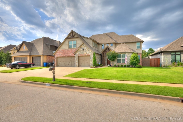 5509 E 121st Pl S, Tulsa, OK 74008 - view of front facade featuring driveway, stone siding, and a garage
