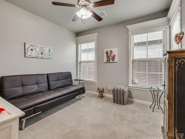 5509 E 121st Pl S, Tulsa, OK 74008 - carpeted living area featuring baseboards and a ceiling fan