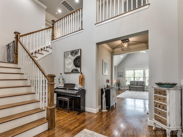 5509 E 121st Pl S, Tulsa, OK 74008 - staircase with crown molding, wood finished floors, recessed lighting, and high vaulted ceiling