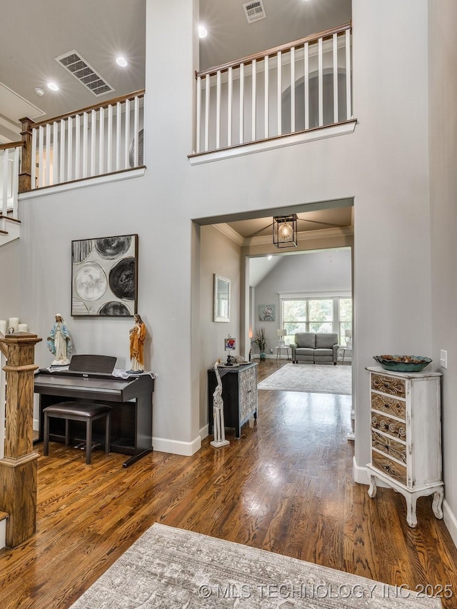 5509 E 121st Pl S, Tulsa, OK 74008 - entrance foyer featuring wood finished floors, a towering ceiling, and recessed lighting