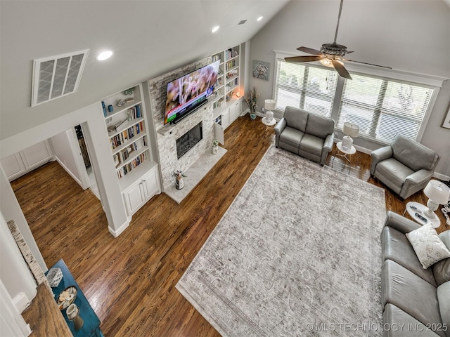 5509 E 121st Pl S, Tulsa, OK 74008 - living room with built in shelves, a ceiling fan, wood finished floors, a premium fireplace, and recessed lighting