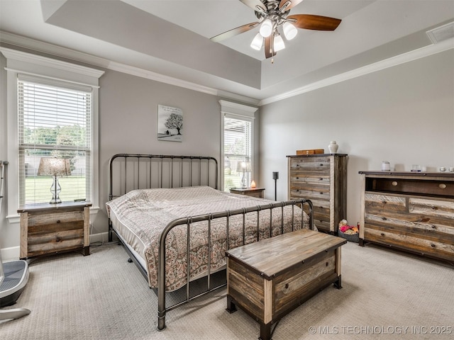 5509 E 121st Pl S, Tulsa, OK 74008 - bedroom featuring light carpet, a tray ceiling, crown molding, and ceiling fan