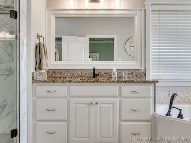 5509 E 121st Pl S, Tulsa, OK 74008 - bathroom with vanity, a marble finish shower, and a garden tub