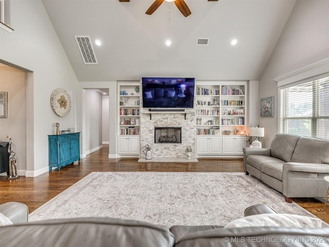 5509 E 121st Pl S, Tulsa, OK 74008 - living room with ceiling fan, wood finished floors, high vaulted ceiling, a fireplace, and built in features
