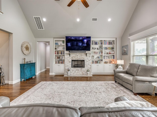 5509 E 121st Pl S, Tulsa, OK 74008 - living area with a ceiling fan, high vaulted ceiling, wood finished floors, a fireplace, and built in features
