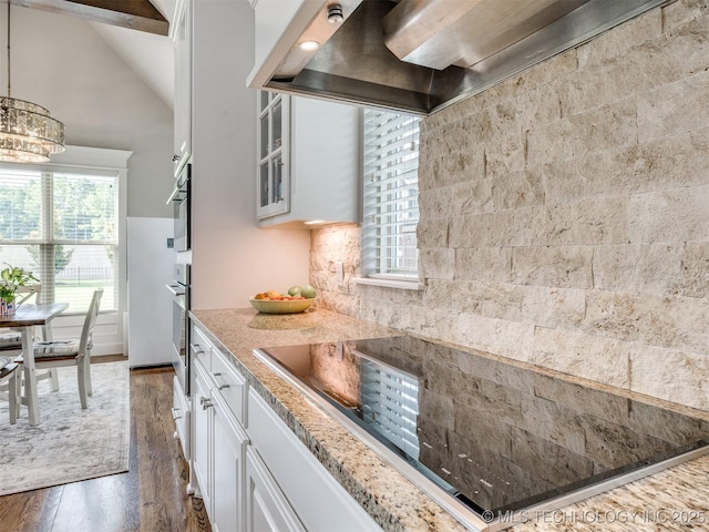 5509 E 121st Pl S, Tulsa, OK 74008 - kitchen featuring custom range hood, dark wood-style floors, white cabinets, black electric stovetop, and high vaulted ceiling
