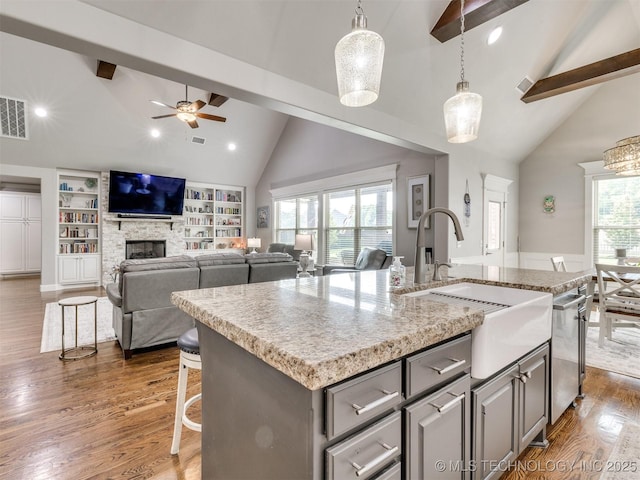 5509 E 121st Pl S, Tulsa, OK 74008 - kitchen with high vaulted ceiling, beam ceiling, dark wood finished floors, gray cabinets, and dishwasher