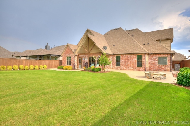 5509 E 121st Pl S, Tulsa, OK 74008 - back of property featuring a fire pit, a patio, brick siding, and roof with shingles