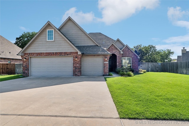 6904 S Chestnut Ave, Broken Arrow, OK 74011 - view of front of property featuring brick siding, driveway, an attached garage, and roof with shingles