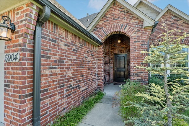 6904 S Chestnut Ave, Broken Arrow, OK 74011 - doorway to property featuring brick siding