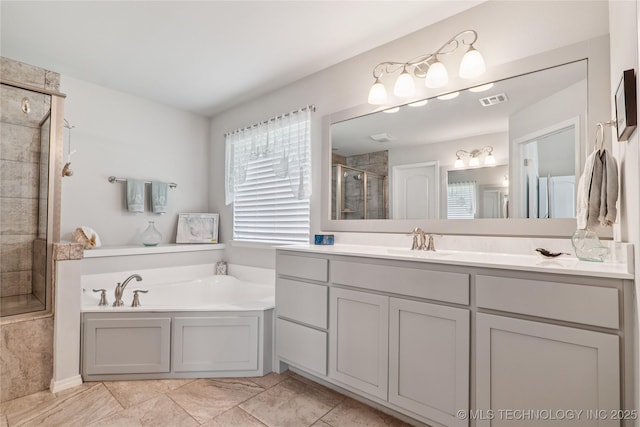 6904 S Chestnut Ave, Broken Arrow, OK 74011 - full bathroom featuring a stall shower, vanity, and a garden tub