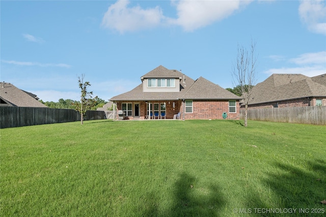 6904 S Chestnut Ave, Broken Arrow, OK 74011 - rear view of house with a fenced backyard and brick siding