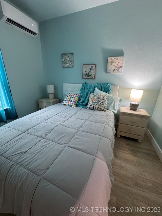 33455 State Highway 82, Cookson, OK 74427 - bedroom with a wall mounted AC and wood finished floors