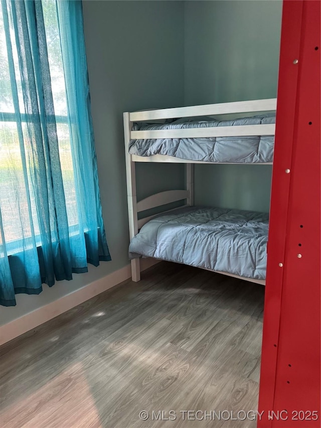 33455 State Highway 82, Cookson, OK 74427 - bedroom featuring wood finished floors and baseboards