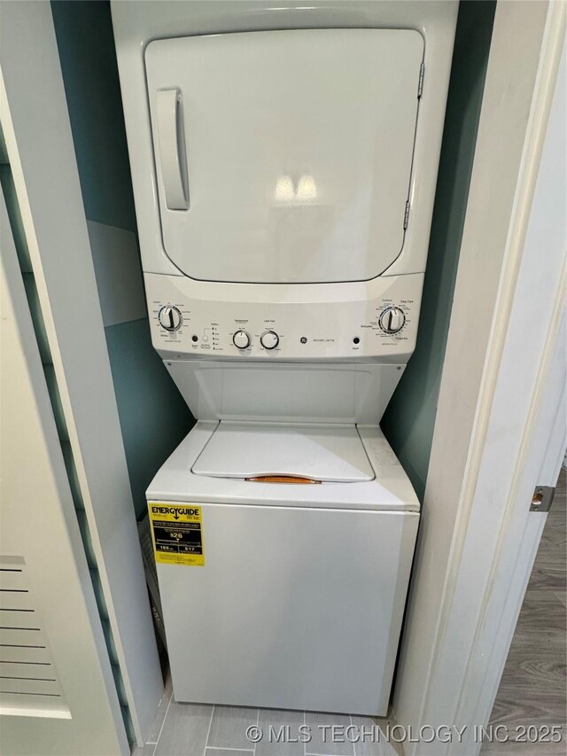 33455 State Highway 82, Cookson, OK 74427 - laundry room featuring stacked washer / dryer