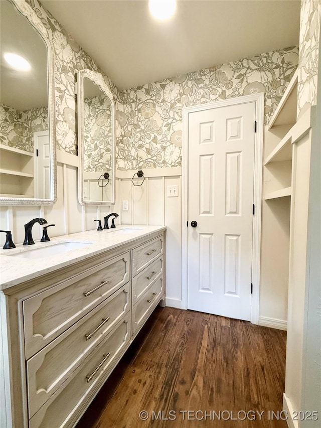 206 S 2nd St, Eufaula, OK 74432 - bathroom with wallpapered walls, double vanity, and wood finished floors