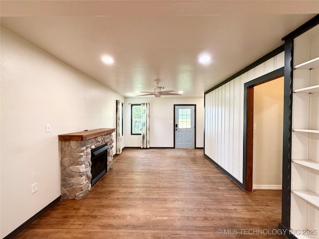 206 S 2nd St, Eufaula, OK 74432 - unfurnished living room featuring wood finished floors, a fireplace, recessed lighting, and a ceiling fan