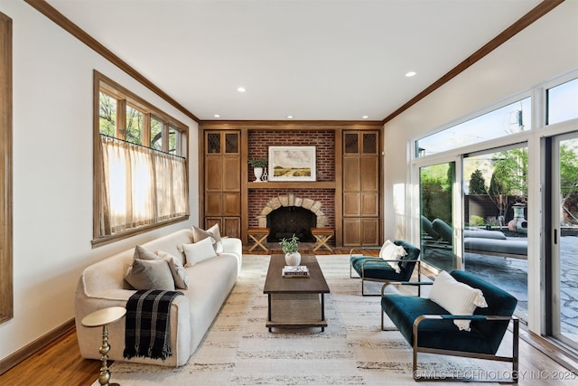 2151 E 27th St, Tulsa, OK 74114 - living area featuring ornamental molding, recessed lighting, wood finished floors, and a fireplace