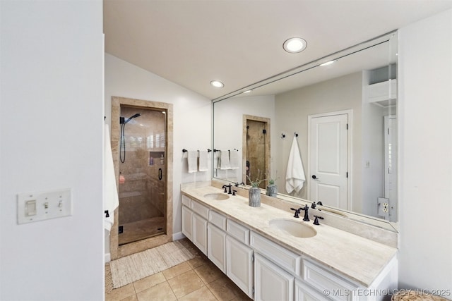 2151 E 27th St, Tulsa, OK 74114 - bathroom with double vanity, a stall shower, recessed lighting, and tile patterned floors