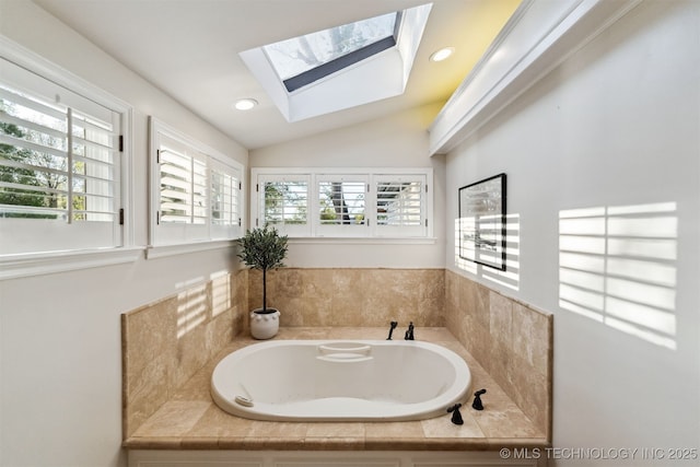 2151 E 27th St, Tulsa, OK 74114 - bathroom with a bath, a skylight, lofted ceiling, and recessed lighting