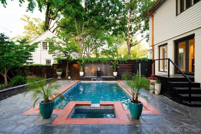 2151 E 27th St, Tulsa, OK 74114 - view of swimming pool featuring french doors, a fenced backyard, a patio area, and a pool with connected hot tub