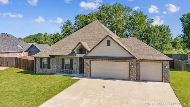 8035 Tims Ln, Claremore, OK 74019 - view of front of property featuring brick siding, a garage, a shingled roof, and driveway